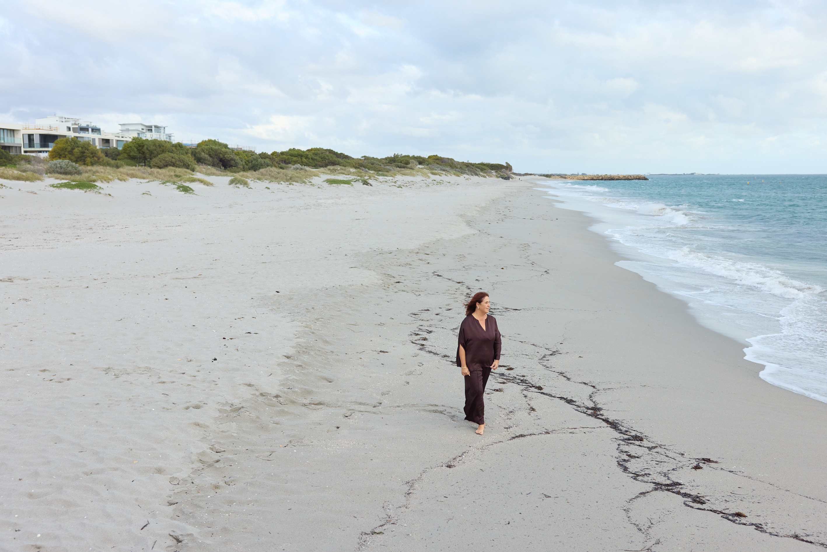 Krasna walking along beach.